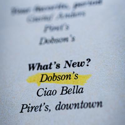 A small printed list of restaurants, Dobson's name highlighted in yellow