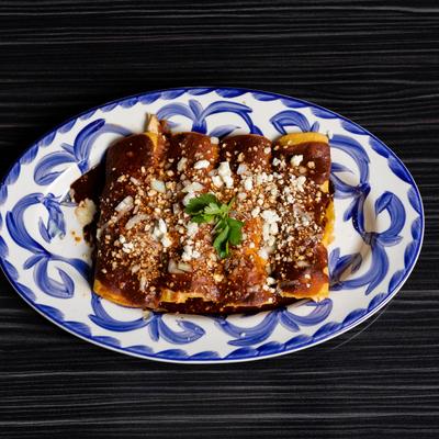 Enchiladas filled with chicken and poblano peppers