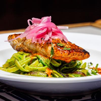 Red Snapper served over pasta, topped with pickled onions.