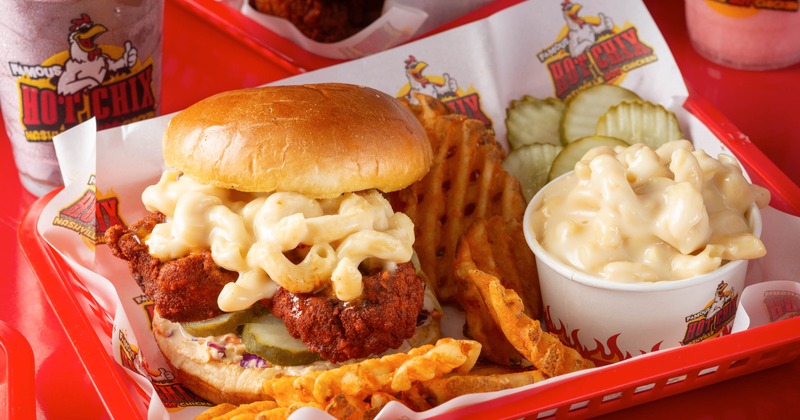 Mac N Chix Sandwich served with waffle fries, pickles, and mac and cheese