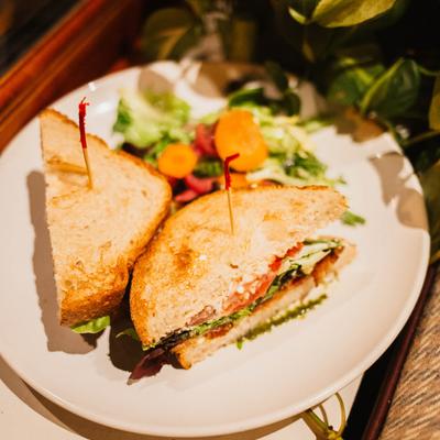 BLT sandwich, served with a salad