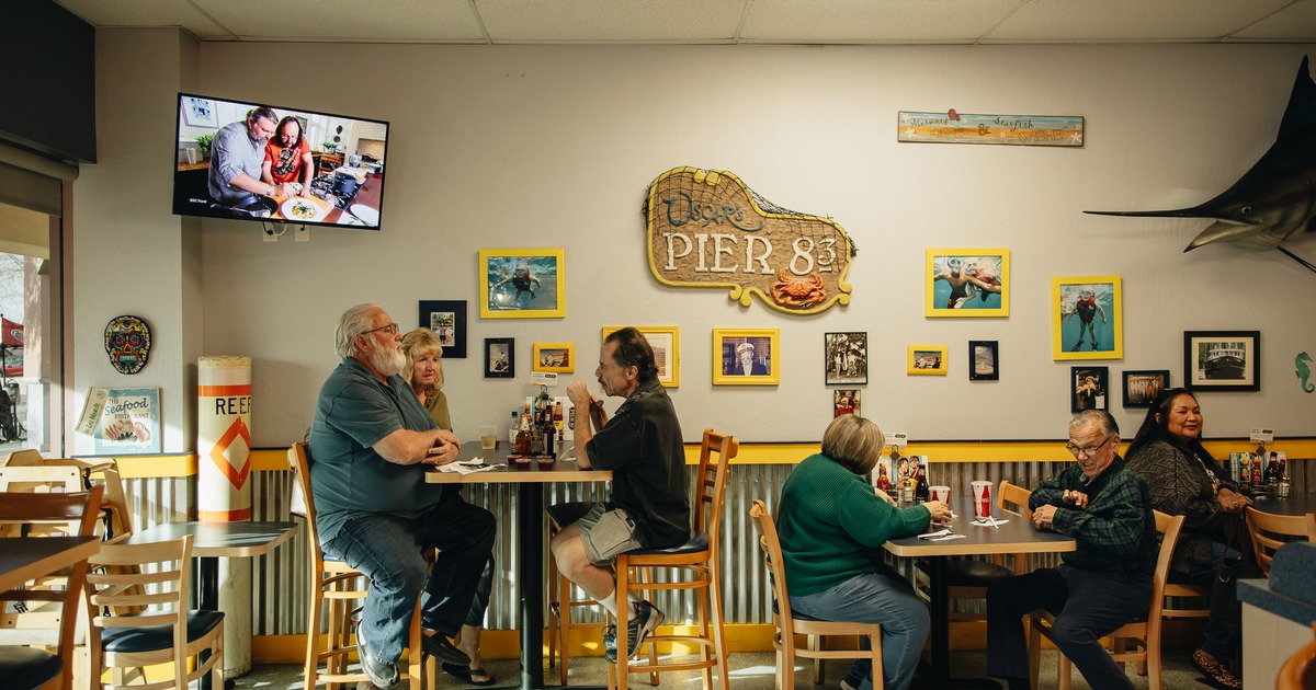interior, diner tables by wall, guests