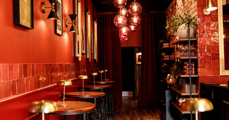 Interior, seating area with bar tables on the left