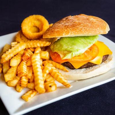 Burger with fries and onion rings.