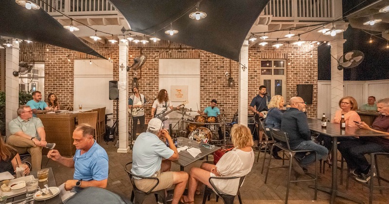 Interior, with guests and band playing live