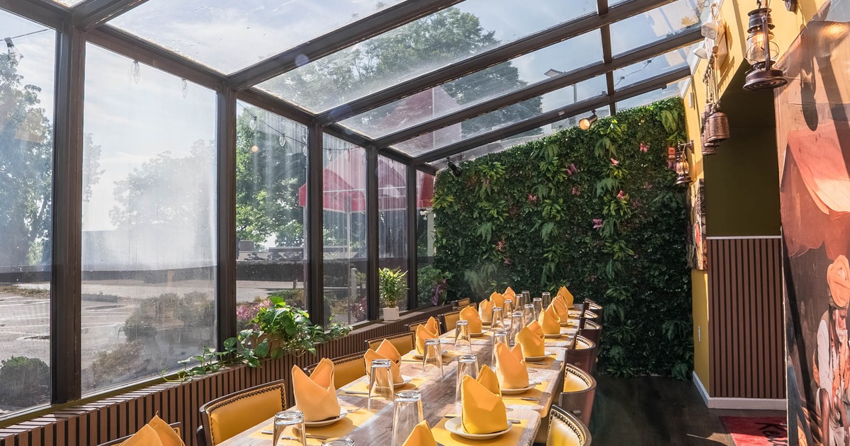 Covered patio with tables and chairs