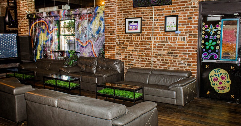 Seating area with couches and walls made of bricks