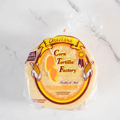 Stack of corn tortillas in packaging.