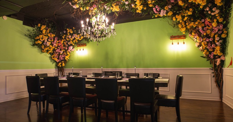 Interior, dining area with flower decoration on the walls