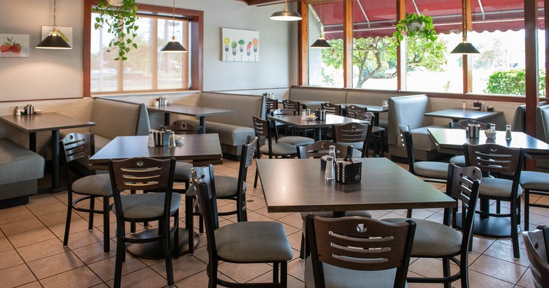 Interior, tables and chairs ready for guests