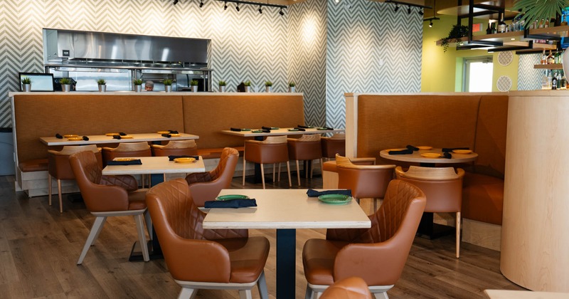 Interior, dining area, tables with chairs, seating booths, banquette bench with tables