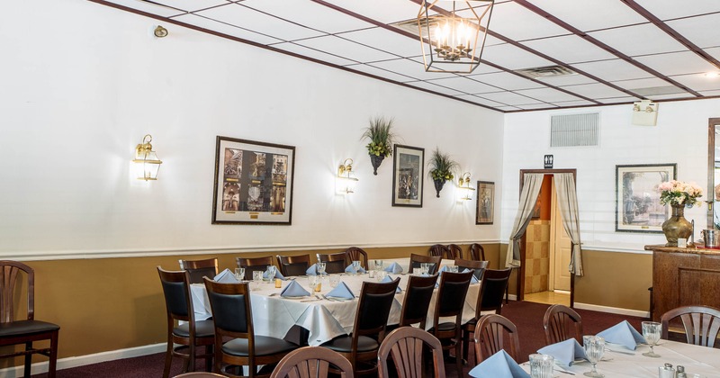 Interior, long table ready for guests