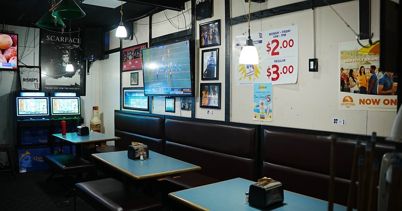 Interior, banquette seating area, tables and chairs