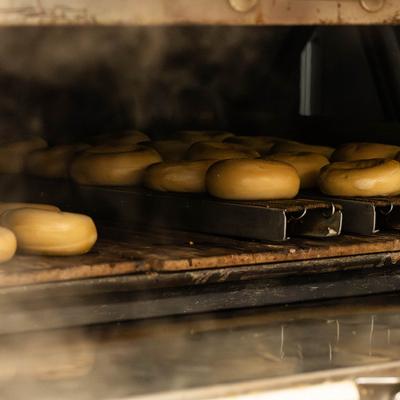 Bagels baking in an oven.