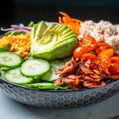 The avocado salad on the table.