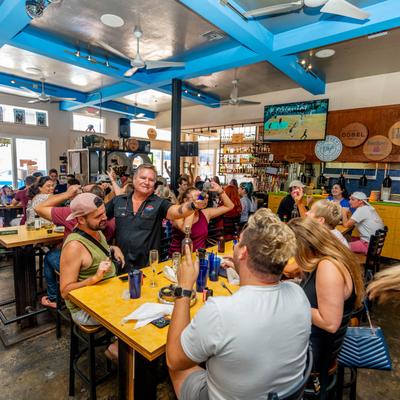 Interior, a crowd of seated guests enjoying their time during a singing performance.
