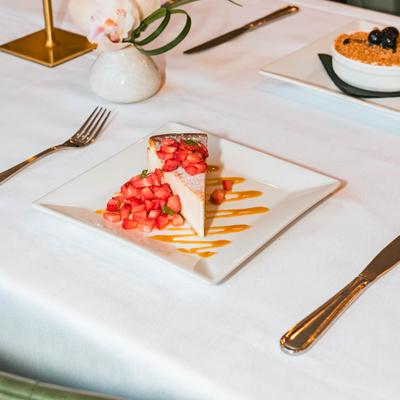 Italian ricotta cheesecake with macerated strawberries.