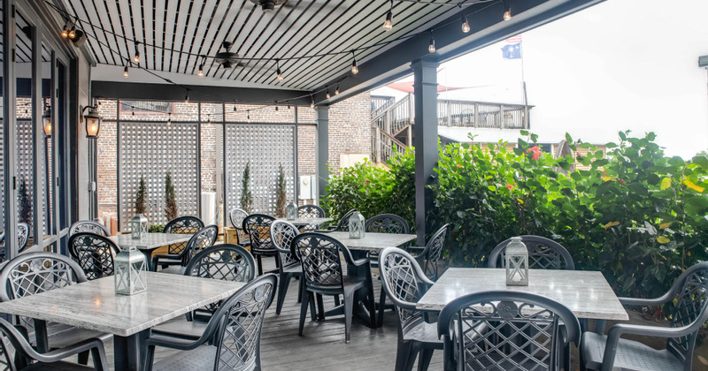 Outdoor seating area, tables decorated with lanterns