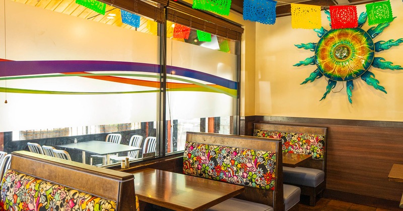 Interior, dining area, wooden seating booths with tables, Mexico inspired decoration