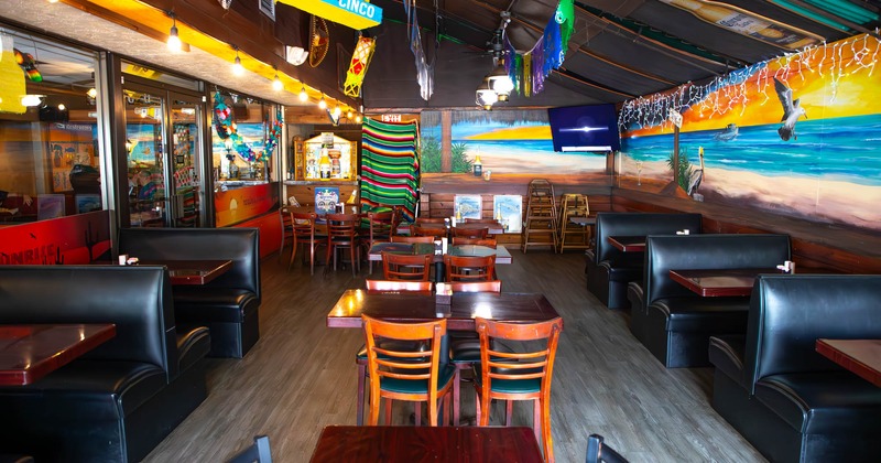 Interior, seating area, various decorations, murals of the beach and ocean on the walls