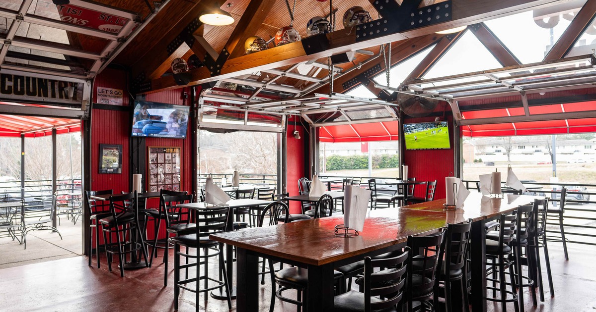 Interior, main dining area with tables and stools