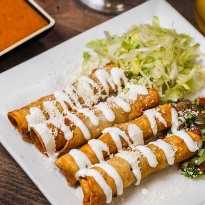 Four flautas topped with sour cream, served with lettuce and pico de gallo.