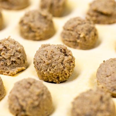 Ravioli filling on a sheet of pasta, close up.