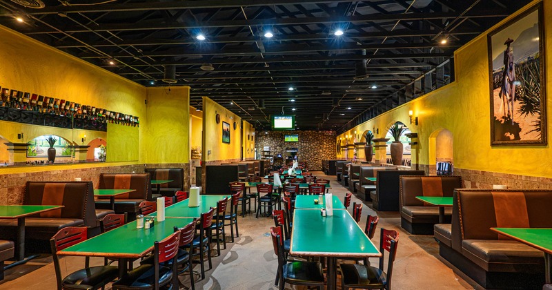 Interior seating area with chairs, tables and booths