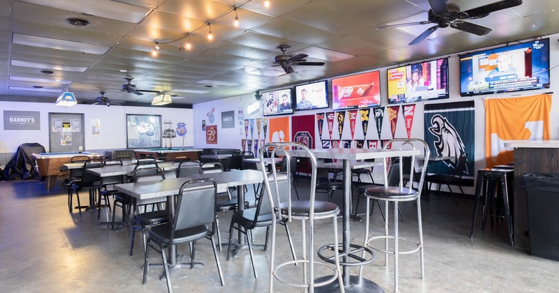 Inside, seating area with bar table and stools