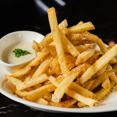 Seasoned fries and dipping sauce