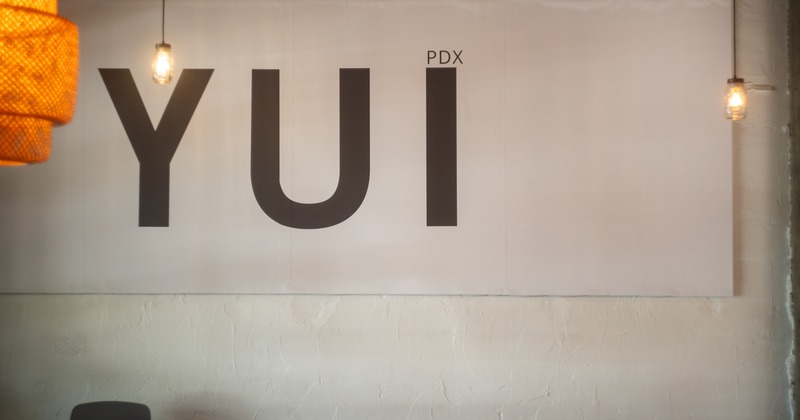 Sign on the wall, table below