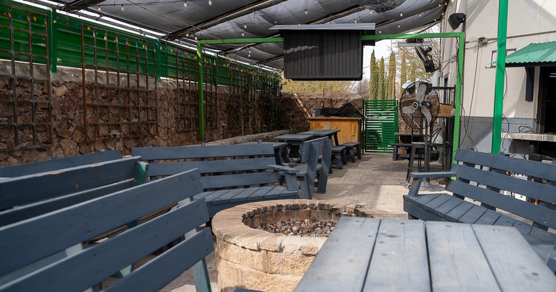 Exterior, patio, fire pit in front, tables, benches