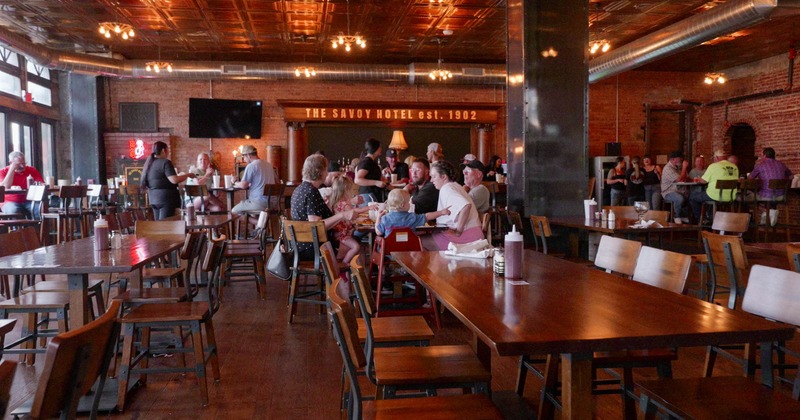 Interior, dining area, guests sitting and chatting