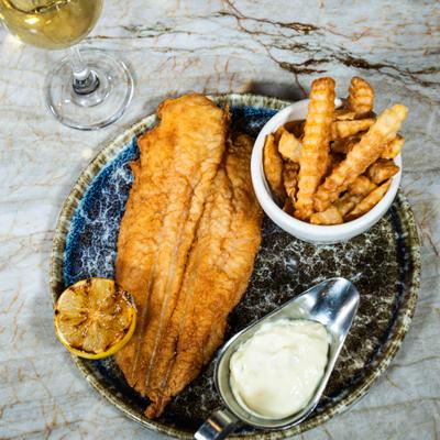Fried Catfish with side of fries, top view.