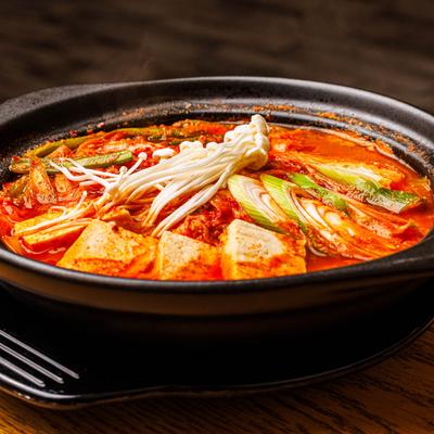 Spicy stew with kimchi, tofu, and veggies.
