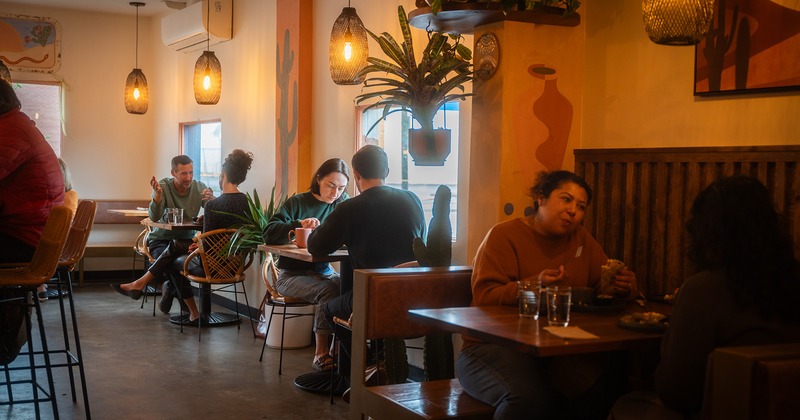 Cozy cafe interior, People engaged in conversations