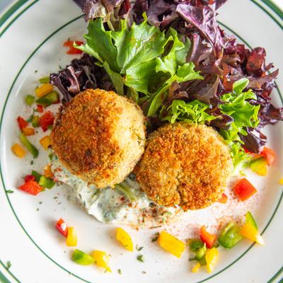 Jumbo Lump Crabcakes--pan seared with cilantro lime mayo and fresh greens.