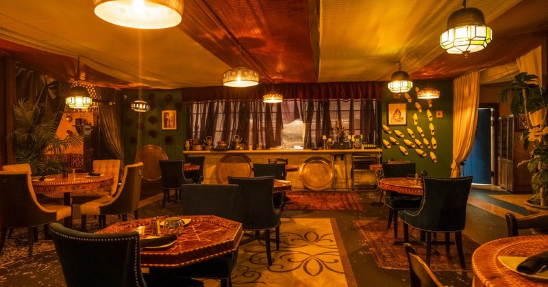 Interior, tables with plates and tableware