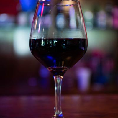 A close up of a glass of red wine.
