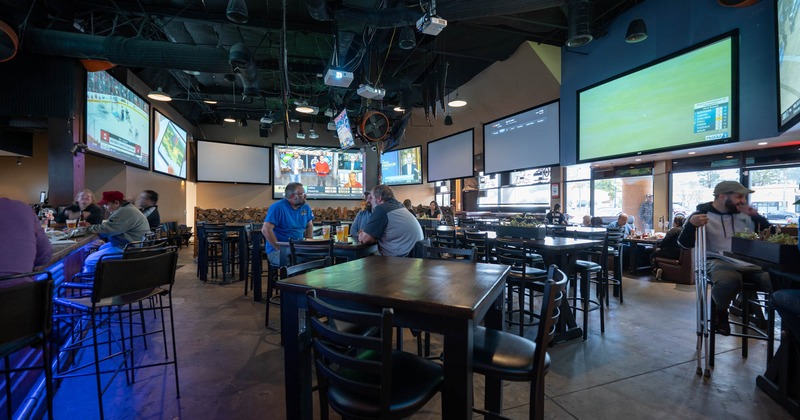 Interior, tables and chairs with guests enjoying their drinks