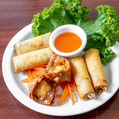 Crab Rangoon and Vegetable Rolls, with sweet and sour dipping sauce.