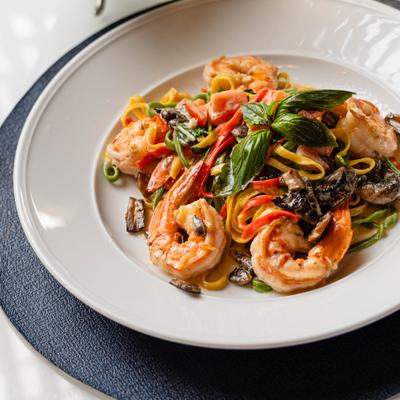 Linguini pasta with shrimp, scallops, squid, clams and fish in tomato sauce.