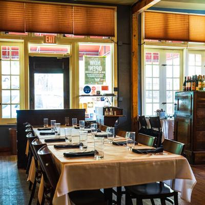 Interior, large set dining table, chairs, windows, glass doors