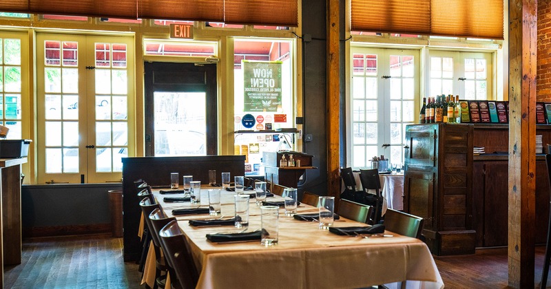 Interior, a long table set for guests