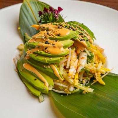 Fuji Salad with shredded crab sticks, sliced avocado, spicy mayo and sesame seeds.