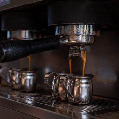 Coffee pouring down from the machine.