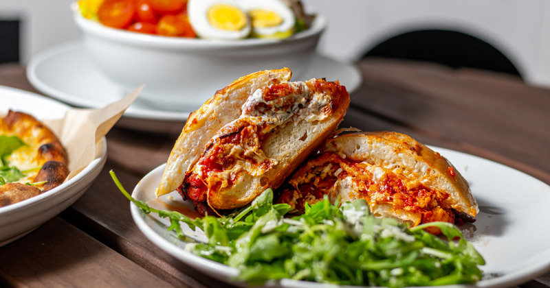 Bolognese sauce with cheese sandwich and arugula