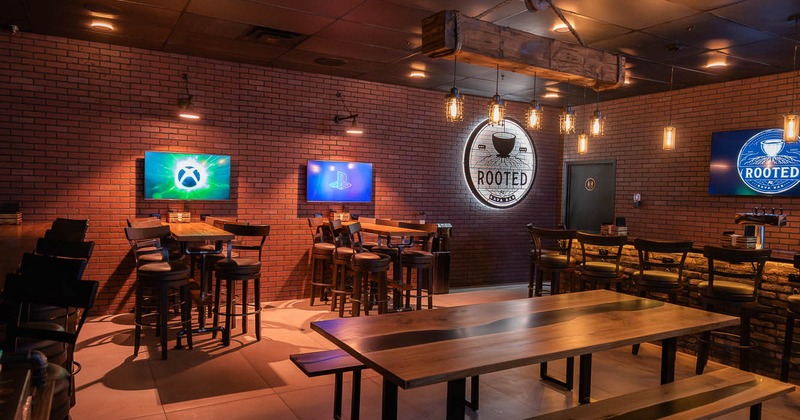 Interior, seating area with TVs on the wall