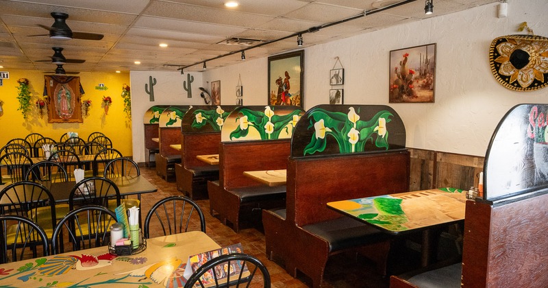 Cozy Mexican-style restaurant interior dining area with dining tables, chairs, and wooden booths