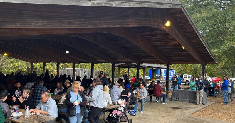 An event, crowd sitting in a roof covered area